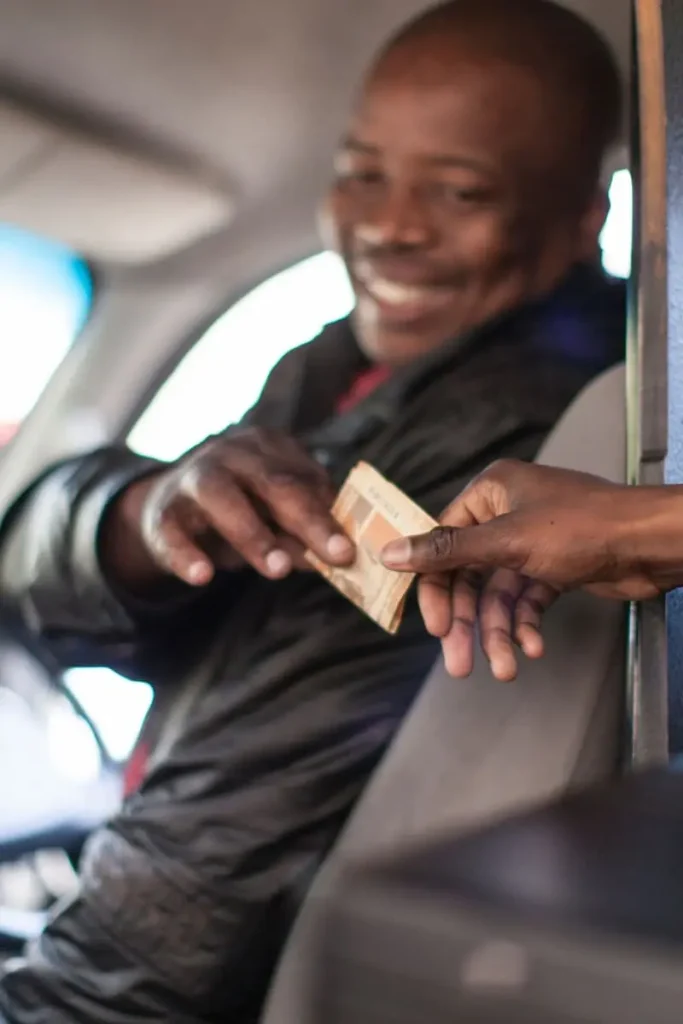 Taxi driver accepting payment